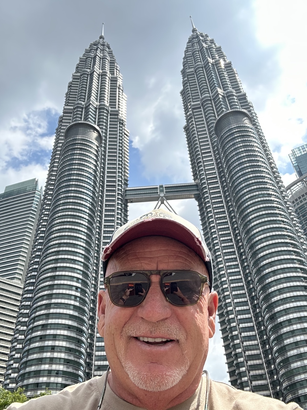 Brent in front of the Petronas Towers, Kuala Lumpur